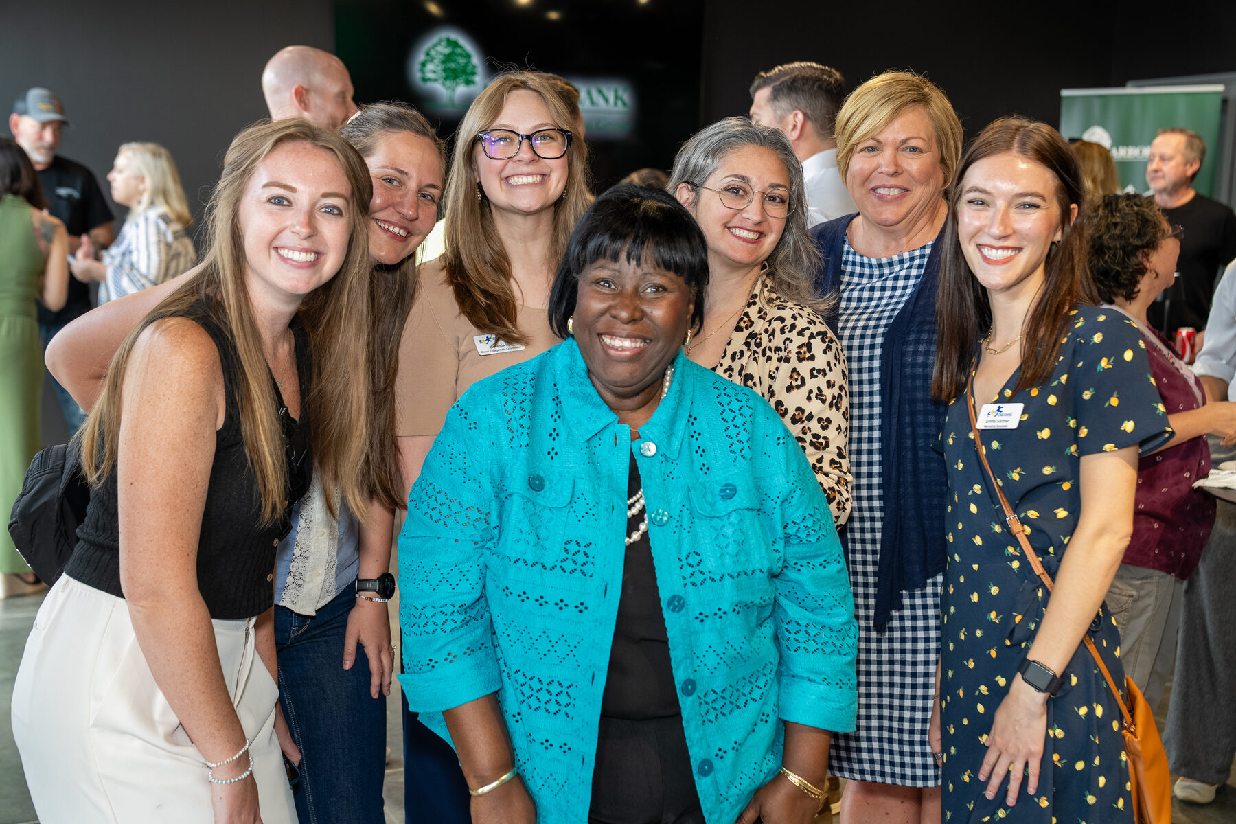 Guests laughing together at a Golden Sheaf networking night in Omaha, covered by B&I Productions